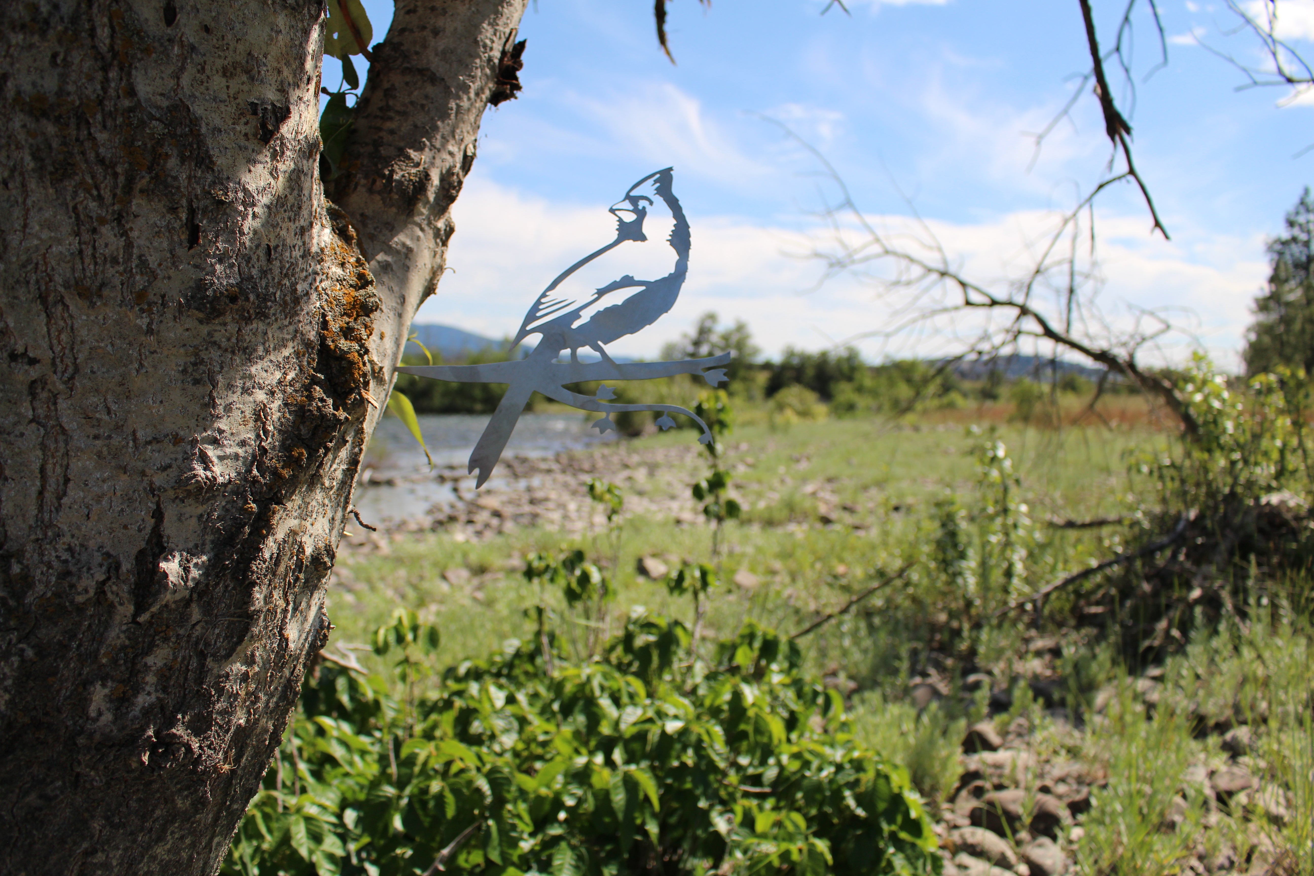 Metal cardinal bird tree stake with branch design, rustic steel garden decoration for outdoor yard or lawn