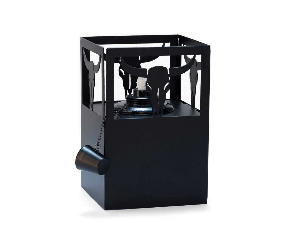 Western-style metal tiki torch featuring bull skull cutout design, handcrafted black steel outdoor lantern for patio or backyard lighting