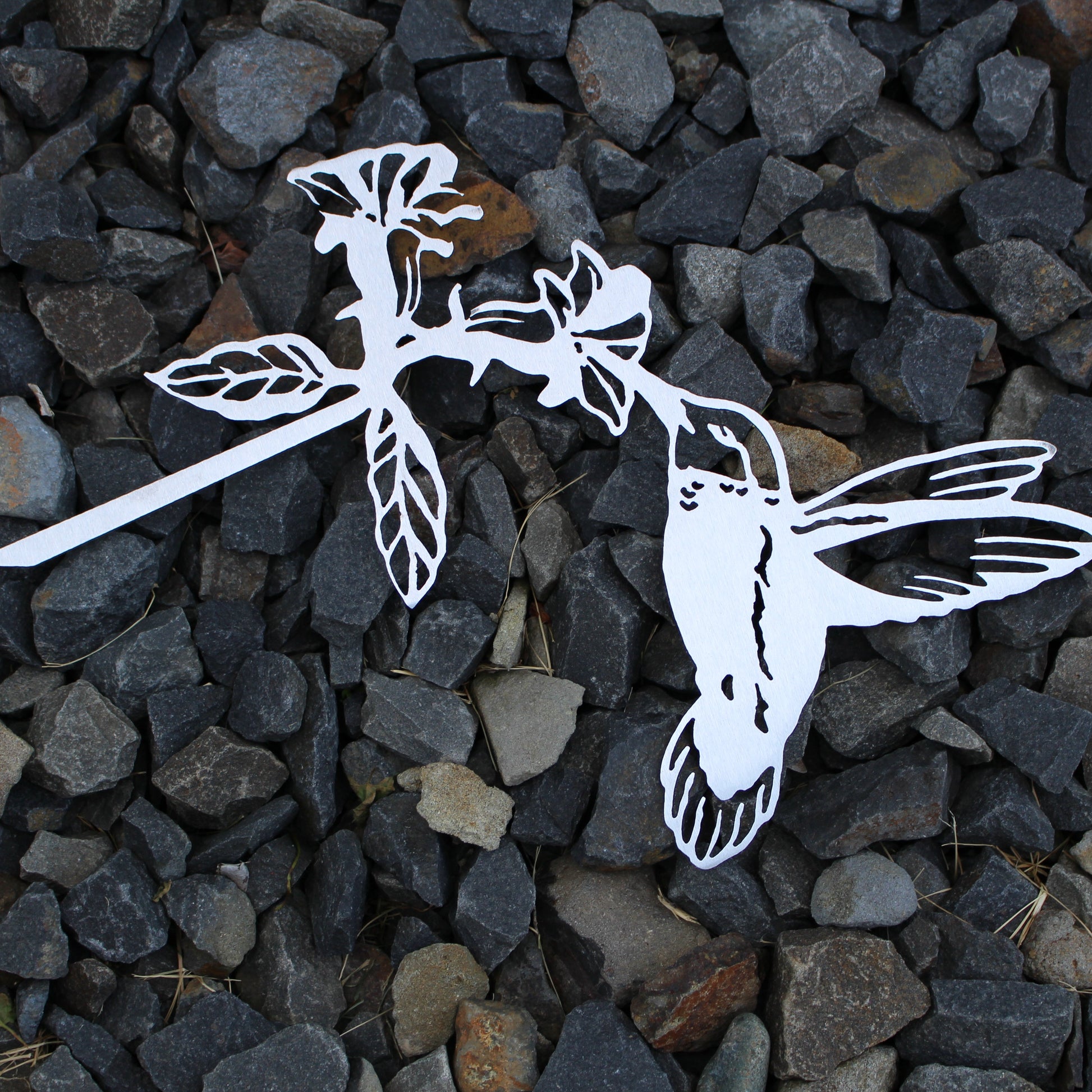 Metal hummingbird tree stake sipping from flower, rustic steel garden decoration for outdoor yard or planter