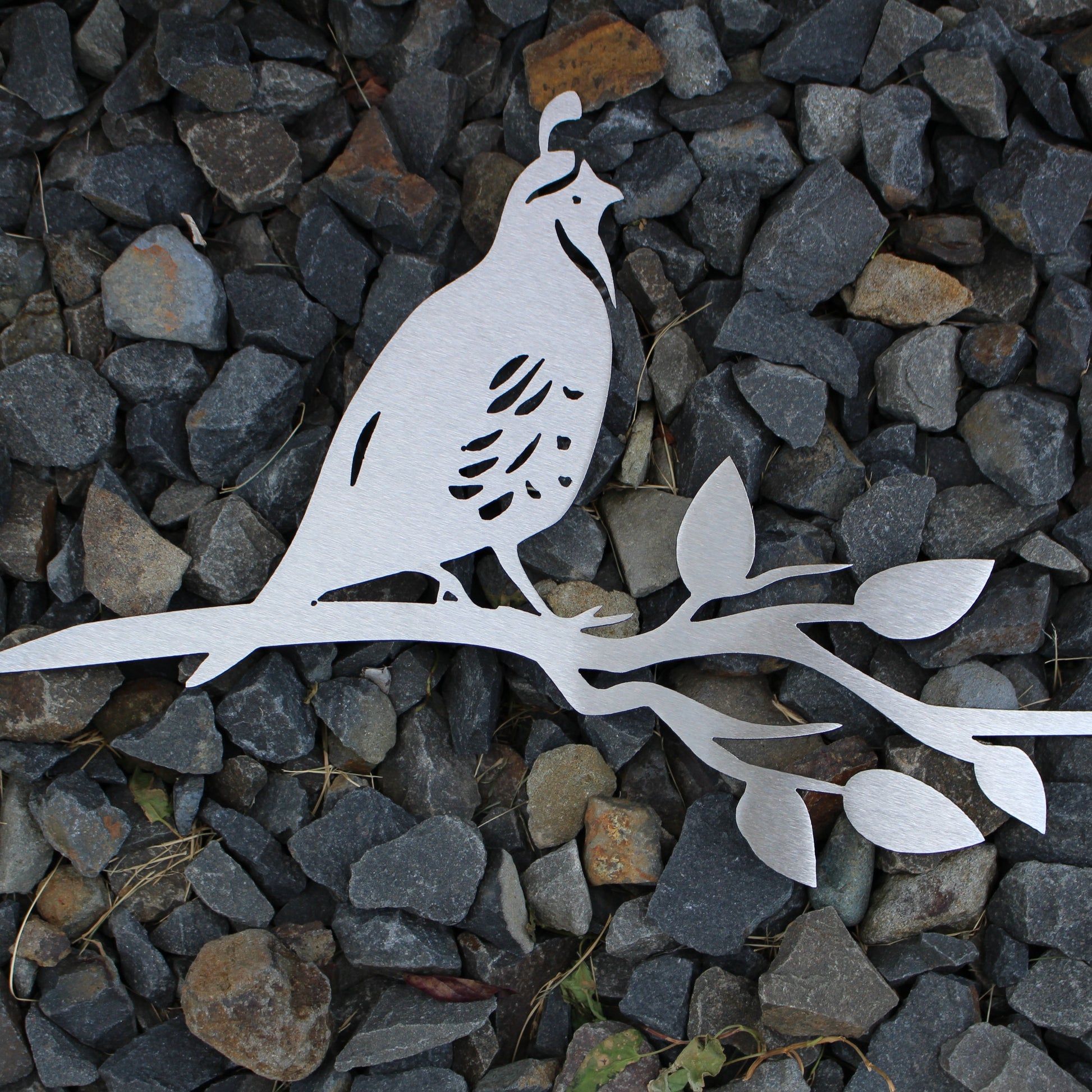 Metal quail tree stake on branch, rustic steel garden decoration for outdoor yard or flower bed